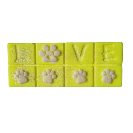 A bright yellowe Scented Wax Melt bar with love and white paw prints