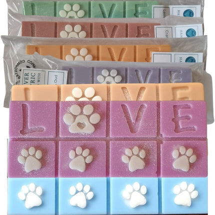 Quaver&Lyric Highly Scented Wax Melt Bars feature a two-tone Love Paws design in green, orange, purple, pink, and blue. Individually wrapped in compostable packaging—perfect for pet lovers.
