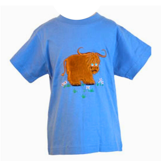 The Ramblers Highland Cow Embroidered T Shirt MacMoo Design for children is a blue 100% cotton short-sleeved tee featuring a cartoon brown highland cow standing on grass with pink and white flowers.