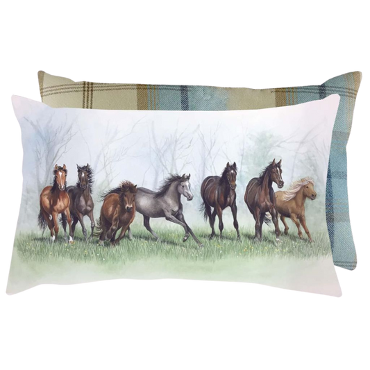 an oblong shaped cushion featuring a group of seven horses and ponies with a light blue and beige plaid reverse