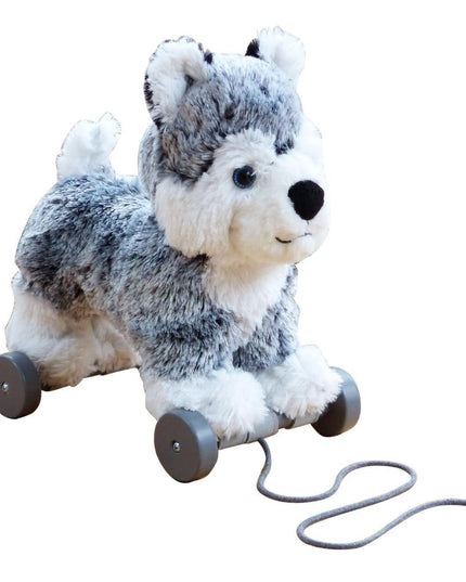 a grey and white soft toy dog on detachable wheels and pull along string