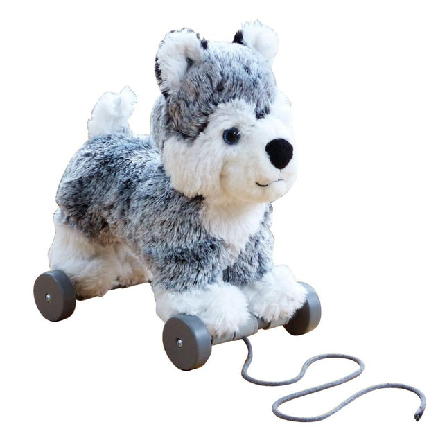 a grey and white soft toy dog on detachable wheels and pull along string
