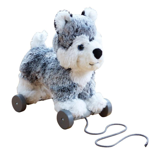 a grey and white soft toy dog on detachable wheels and pull along string