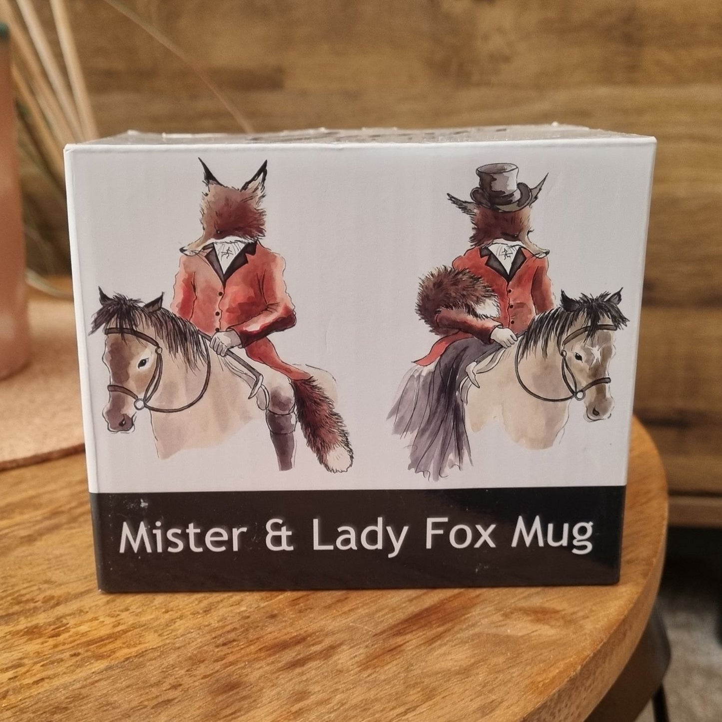 a box showing both sides of the  Mr and lady fox mug on the front of the box