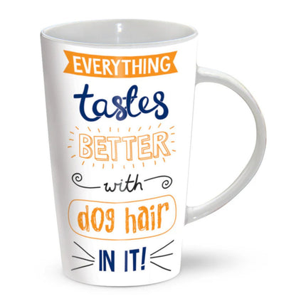A white latte mug adorned with the phrase "Everything Tastes Better With Dog Hair In It," in orange and blue,