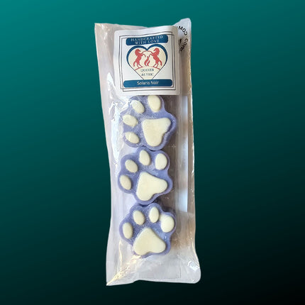 four blue paw shaped wax melts with white paw pads in a packet with quaver & lyric rearing horse branding