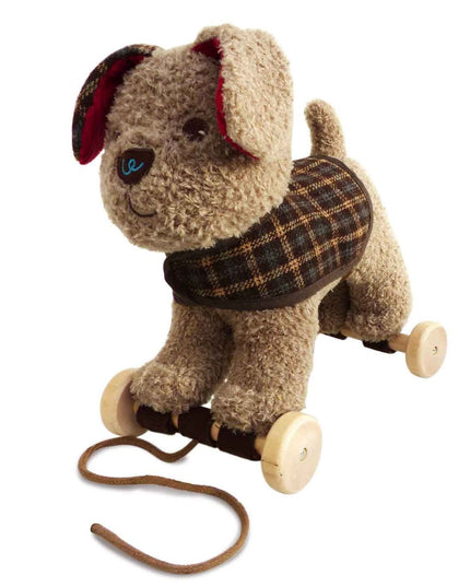 a cute cuddly beige coloured soft toy dog with a checked jacket on wheels to pull along
