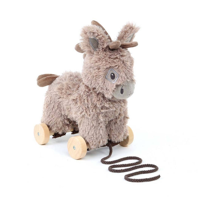 The Pull Along Baby Toy Donkey Norbert by Little Bird Told Me UK features a plush donkey on four wooden wheels, brown face, brown tail, and a black pull stringâ€”perfect for encouraging motor skills in little ones.
