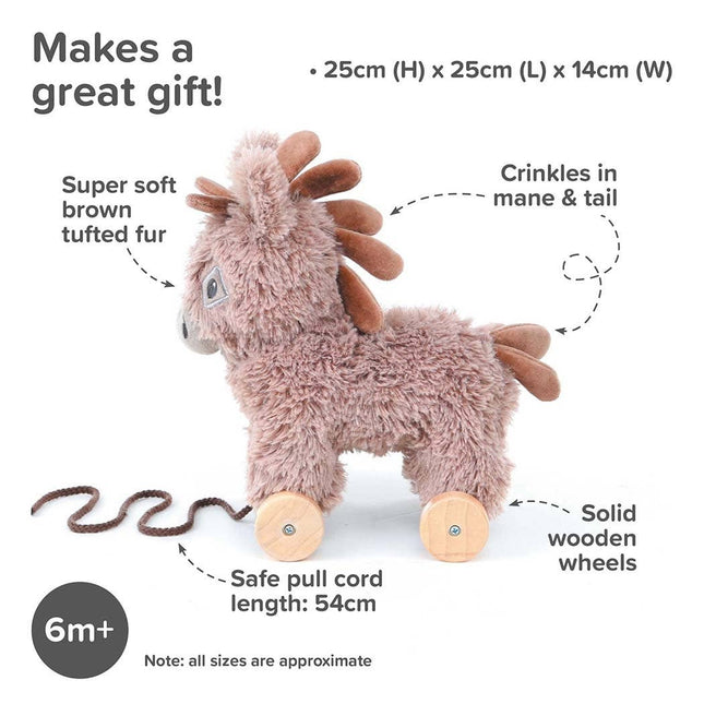 The Pull Along Toy Donkey Norbert by Little Bird Told Me UK is a plush brown donkey with wooden wheels, tufted fur, crinkled mane/tail, and a 54cm pull cord. Ideal for ages 6+ months to encourage motor skills. Size: 25x25x14cm.