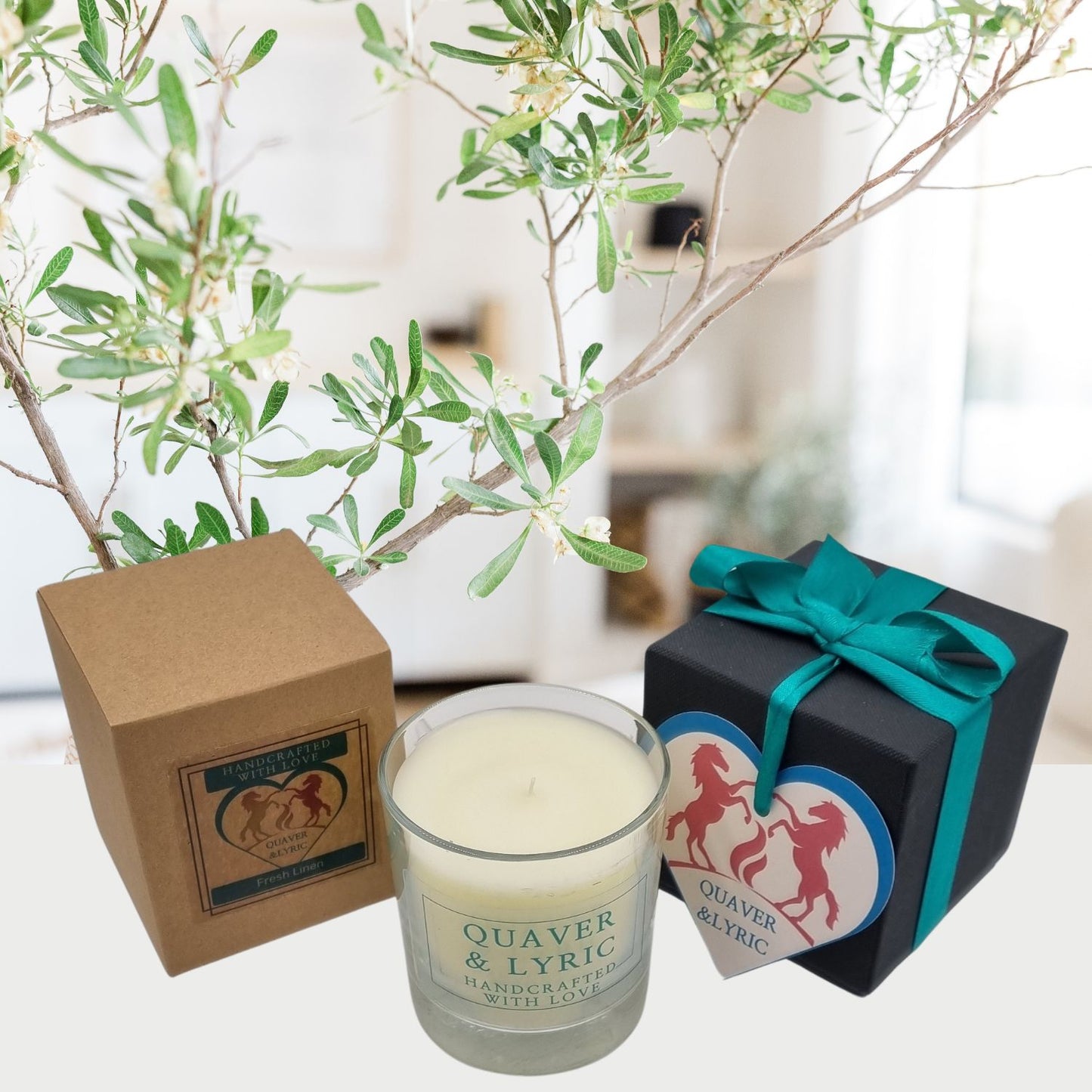 a scented candle with quaver and lyric handcrafted with love label next two a kraft box and black luxury gift box