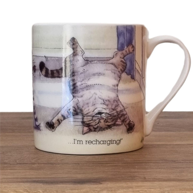 The Cat Mug Alisons Animals Re-charging Cartoon Gift Boxed by Alisons Animals features a relaxed tabby cat illustration with the words “…I’m recharging!”—a perfect gift for cat lovers.