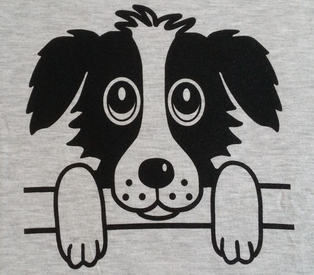 The British Country Collection Printed Dog T Shirt Rex Design features a black and white cartoon dog with big eyes and floppy ears, peeking over a lineâ€”perfect for childrenâ€™s 100% cotton clothing.