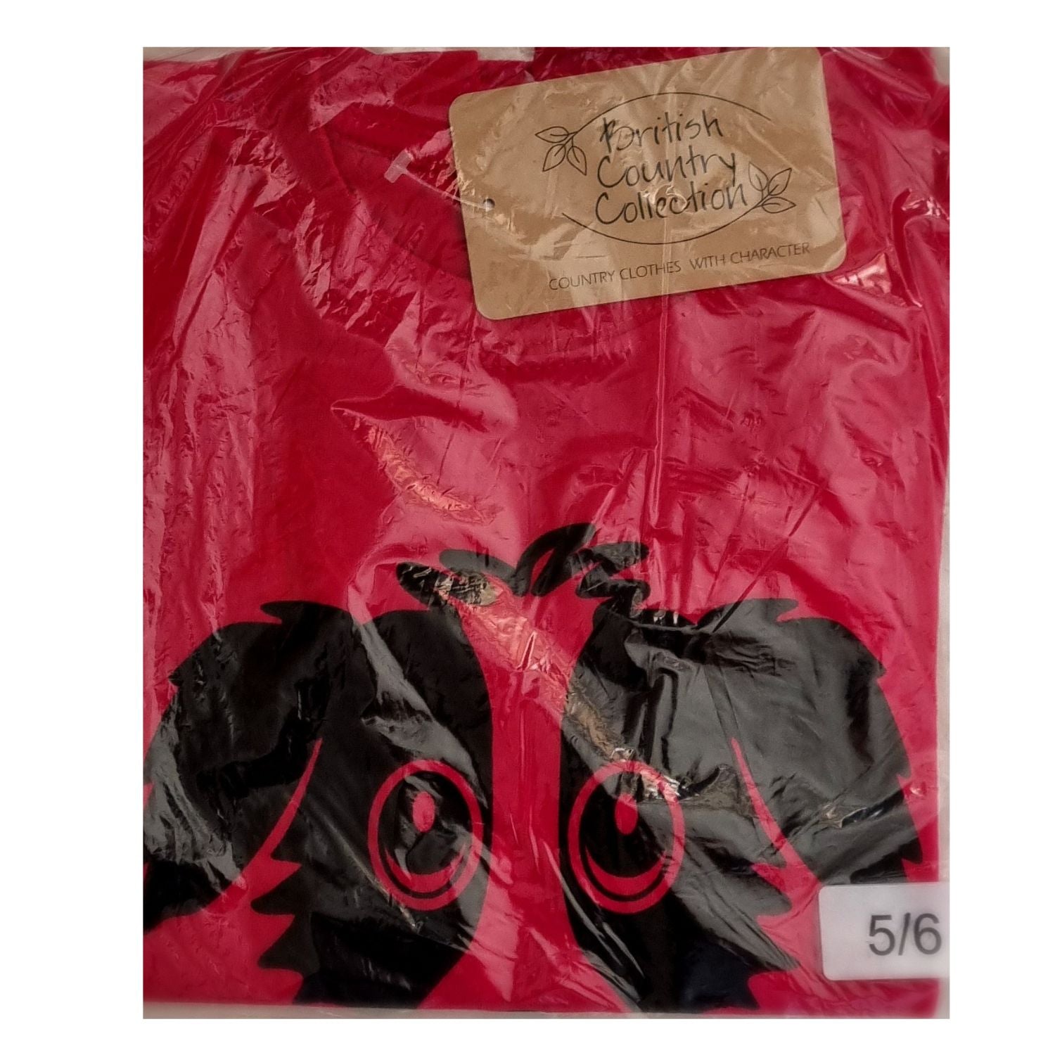 A red cotton Childrens T-shirt from British Country Collection, packaged in plastic, features a Rex the Dog cartoon design and a size sticker marked 5/6.