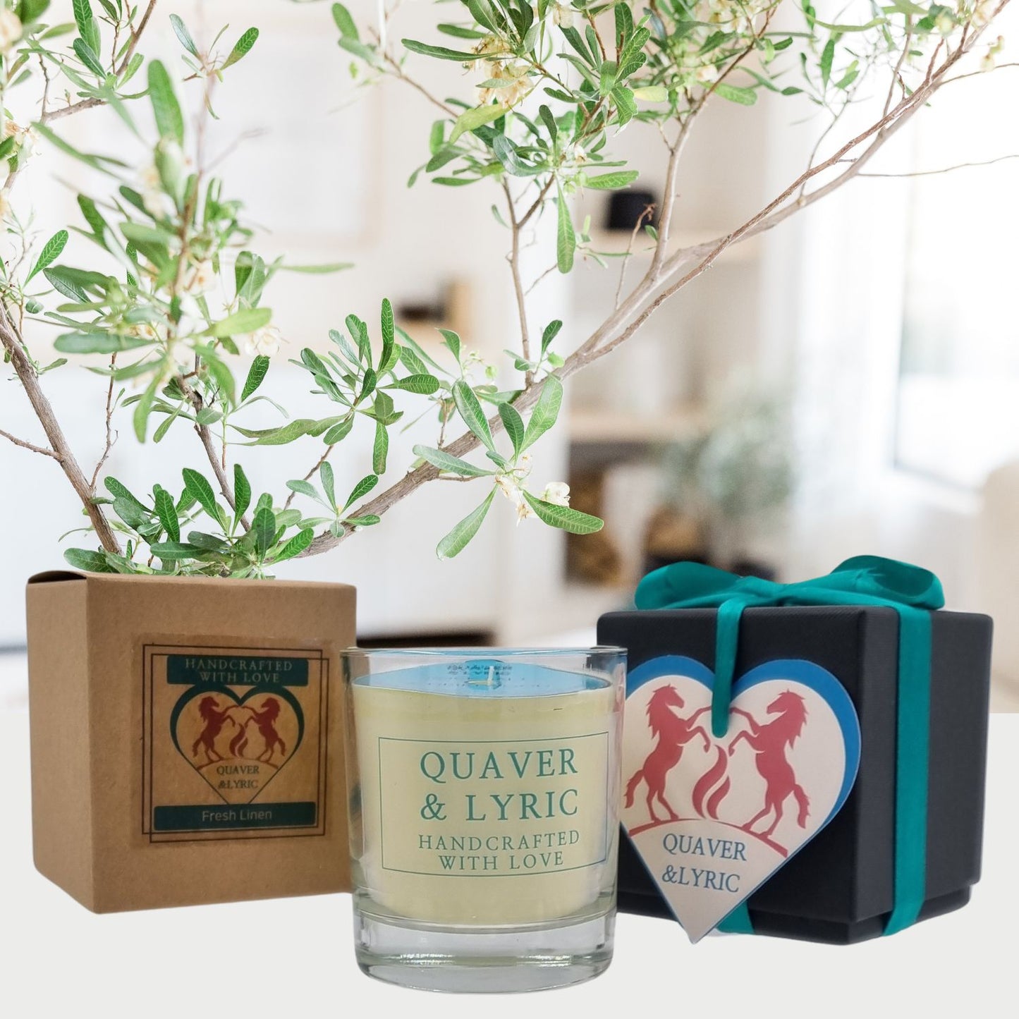 a scented candle with quaver and lyric handcrafted with love label next two a kraft box and black luxury gift box