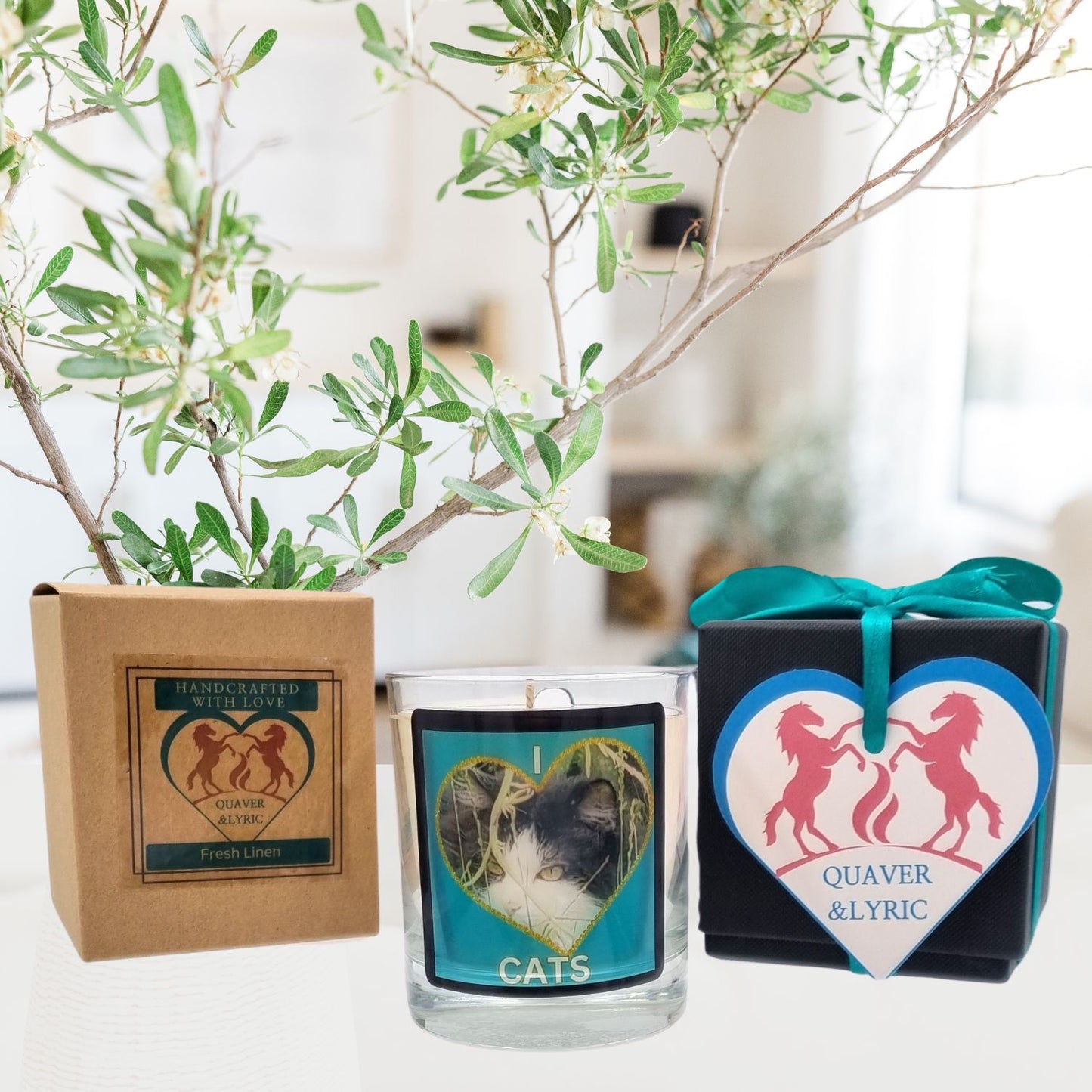 scented candle in glass container with fluffy black and white cat in a heart love cats design in a room setting with the packaging and gift box