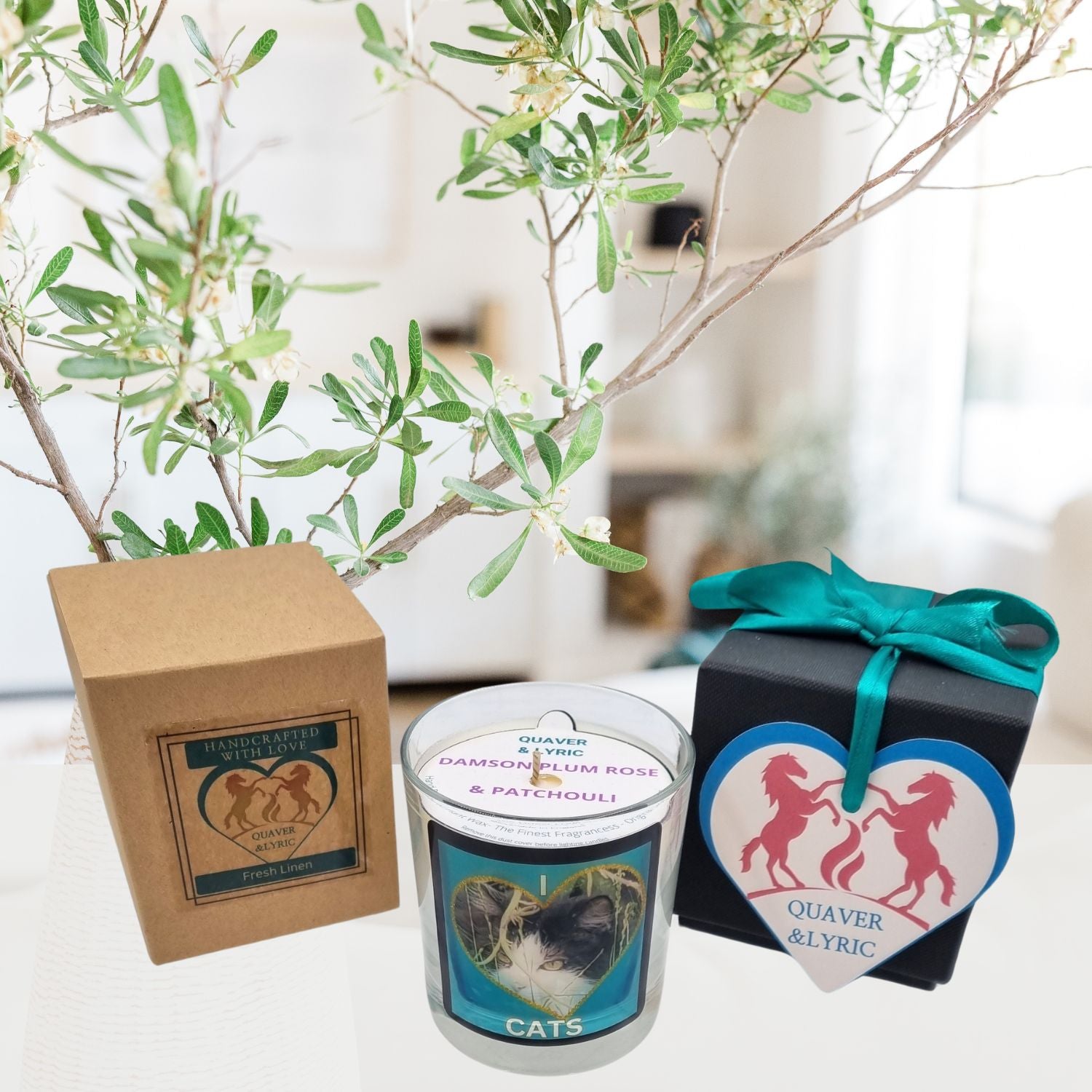 scented candle in glass container with fluffy black and white cat in a heart love cats design in a room setting with the packaging and gift box