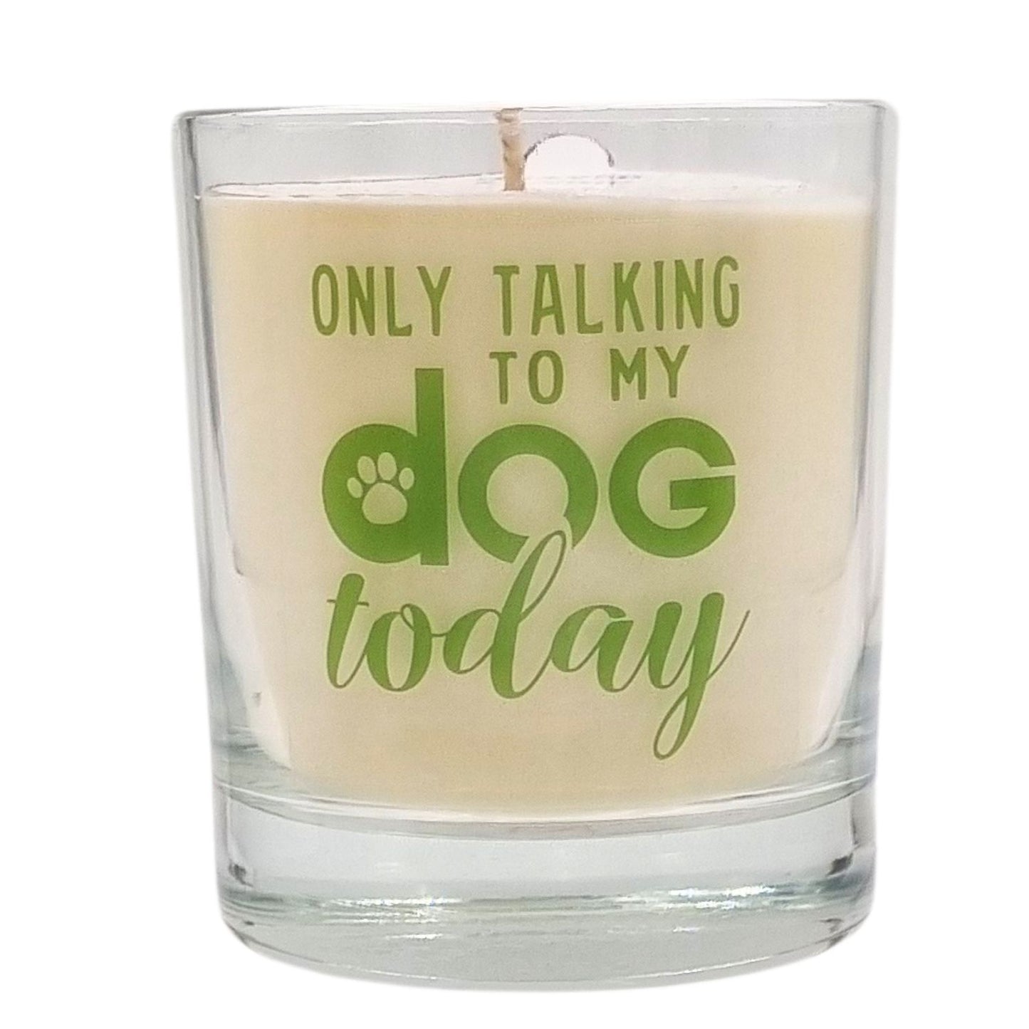 scented candle in gass container with only talking to my dog today written on the glass in green