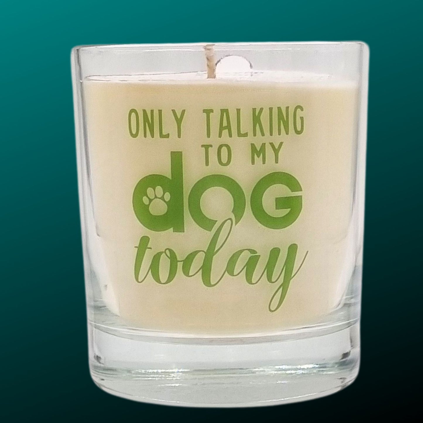 scented candle in gass container with only talking to my dog today written on the glass in green