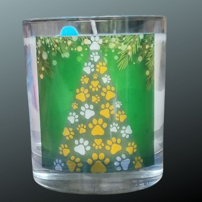 A Christmas scented candle with a Christmas Tree made from yellow and white paws design
