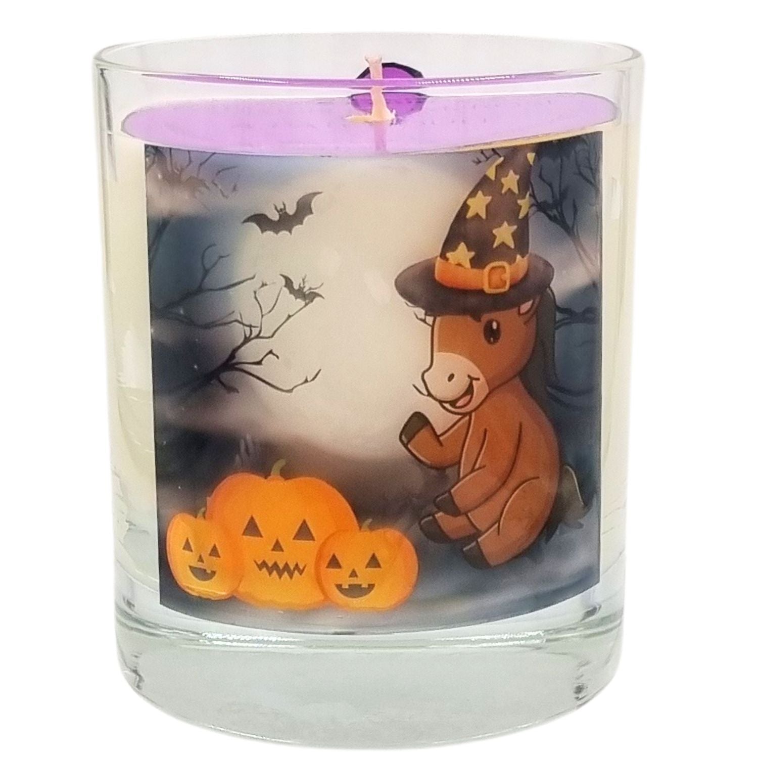 a scented Halloween candle in a glass container with a cute cartoon pony and pumpkin design