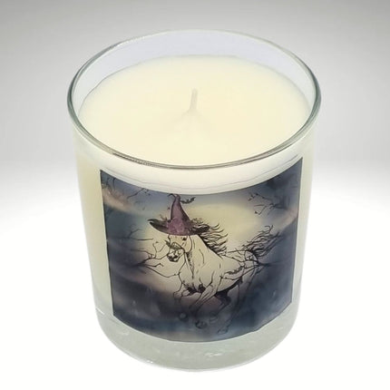 a scented halloween candle featuring a spooky galloping horse design