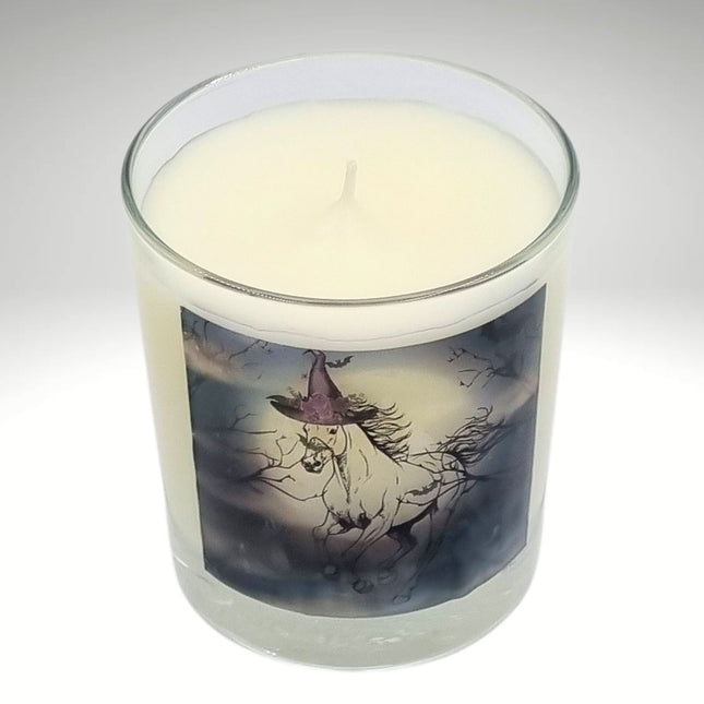a scented halloween candle featuring a spooky galloping horse design