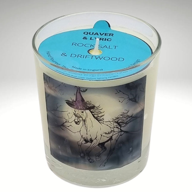 a scented halloween candle featuring a spooky galloping horse design