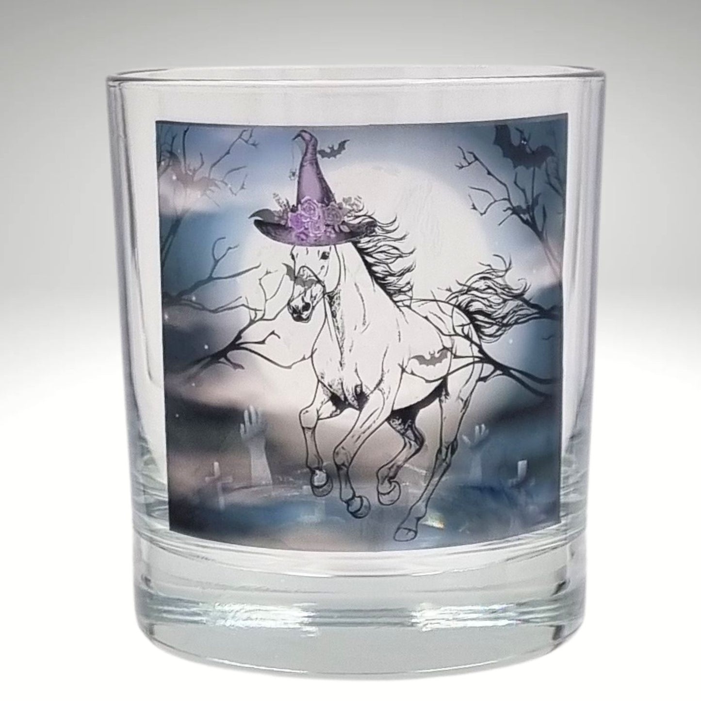 an empty halloween tealight candle holder featuring a spooky galloping horse design