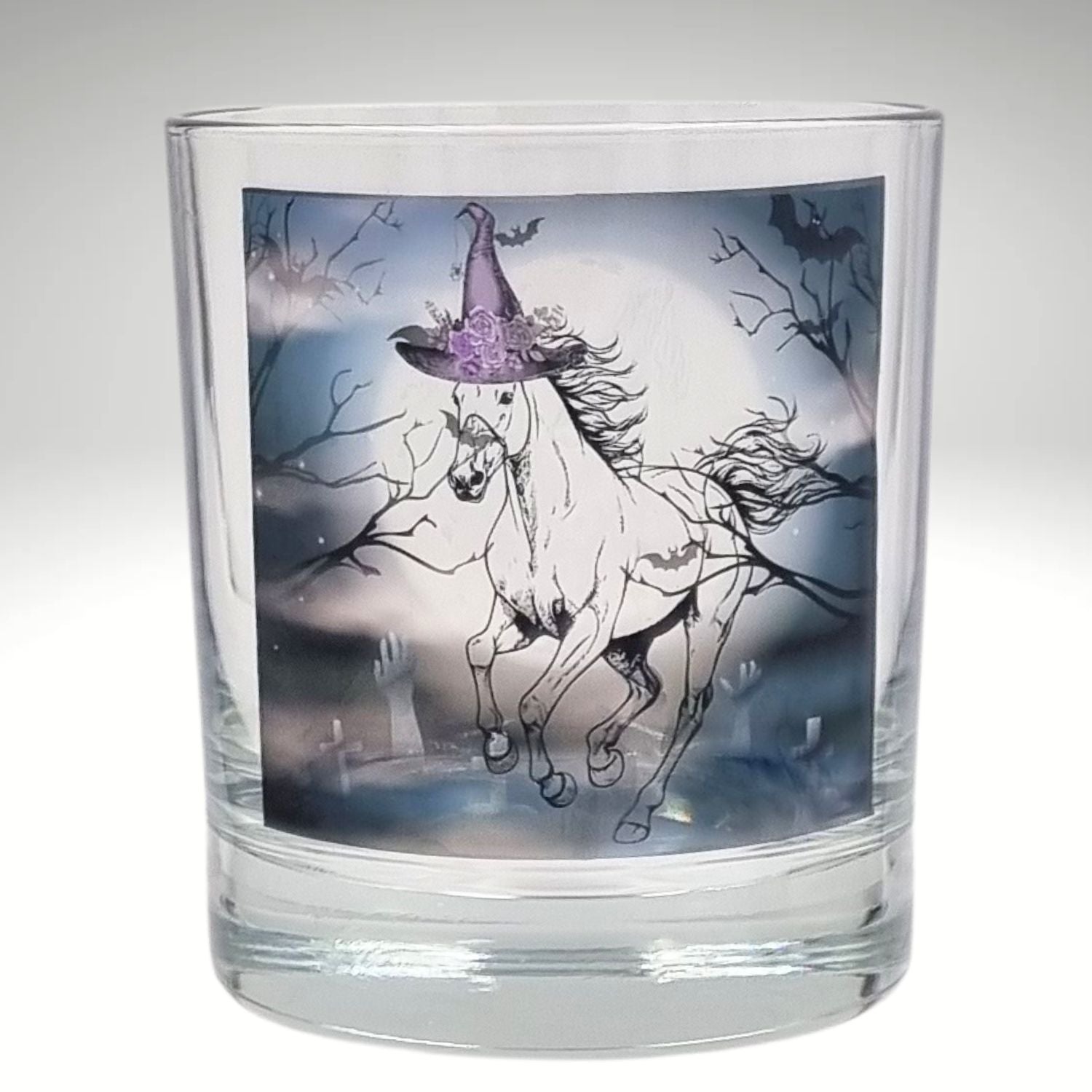 an empty halloween tealight candle holder featuring a spooky galloping horse design