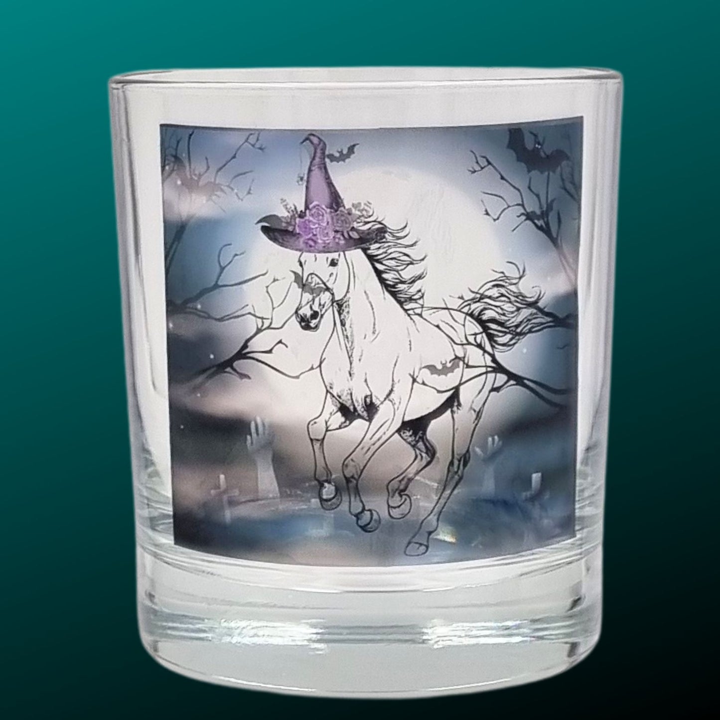 an empty halloween tealight holder featuring a spooky galloping horse design