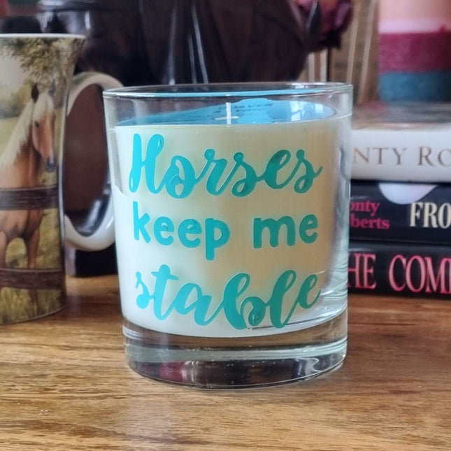 The Quaver&Lyric Scented Candle In Glass Container features teal Horses Keep Me Stable textâ€”an ideal horse loverâ€™s gift with premium fragrance, perfect for handmade candle enthusiasts.