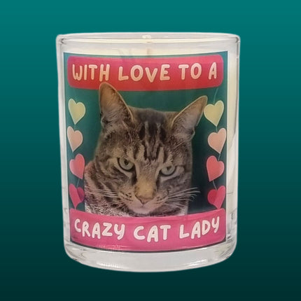 The Quaver&Lyric Scented Candle In Glass Container features a Bengal cat surrounded by colorful hearts and With love to a crazy cat lady text, plus premium fragrances for an extra special touch.