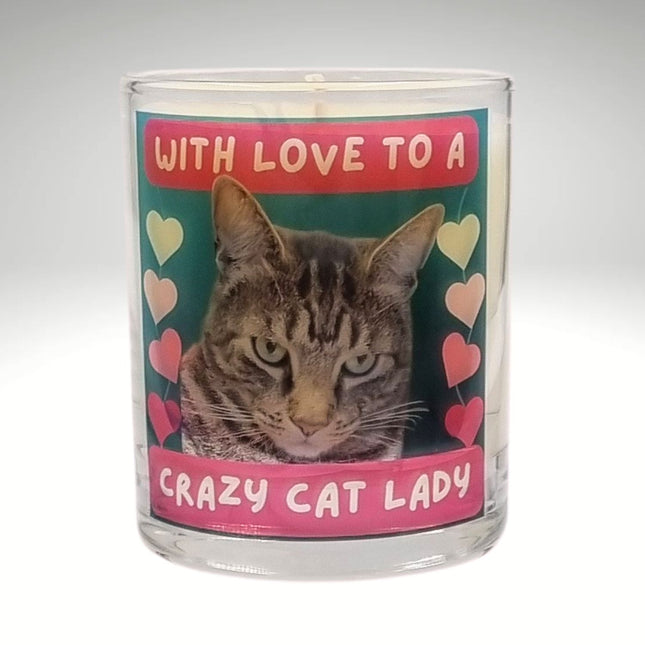 The Quaver&Lyric Scented Candle In Glass Container features a Bengal cat, colorful hearts, and â€œWith love to a crazy cat ladyâ€ on pink and redâ€”infused with premium fragrance, perfect for gifting!.