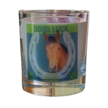 The Quaver&Lyric Scented Candle In Glass Container features a Good Luck horse and horseshoe design, accented with green shamrocksâ€”perfect for showcasing premium fragrances and adding a charming touch to your space.
