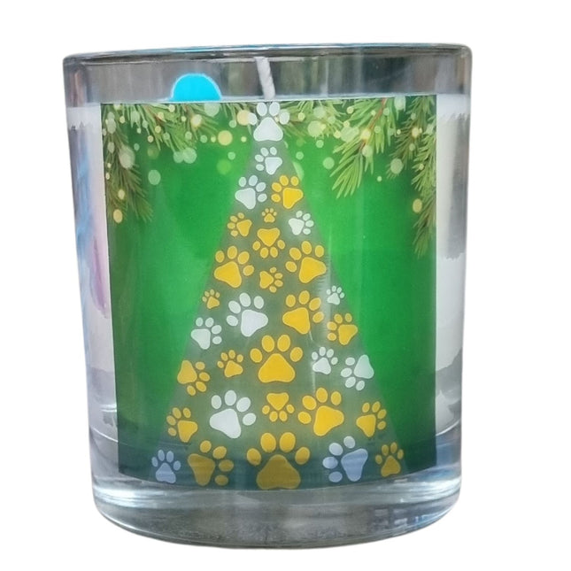 A Christmas scented candle with a Christmas Tree made from paws design 