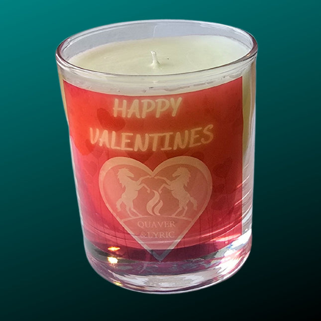 The Quaver&Lyric Scented Happy Valentine Candle (30cl) features a red HAPPY VALENTINES label above two unicorns and the Quaver&Lyric logo, crafted with premium fragrances in glass. Handmade in Barton Seagrave.