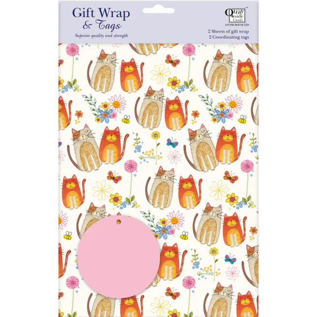 a pack of gift wrap paper with cute brown and orange cats and flower on a white background with a pink circular gift label