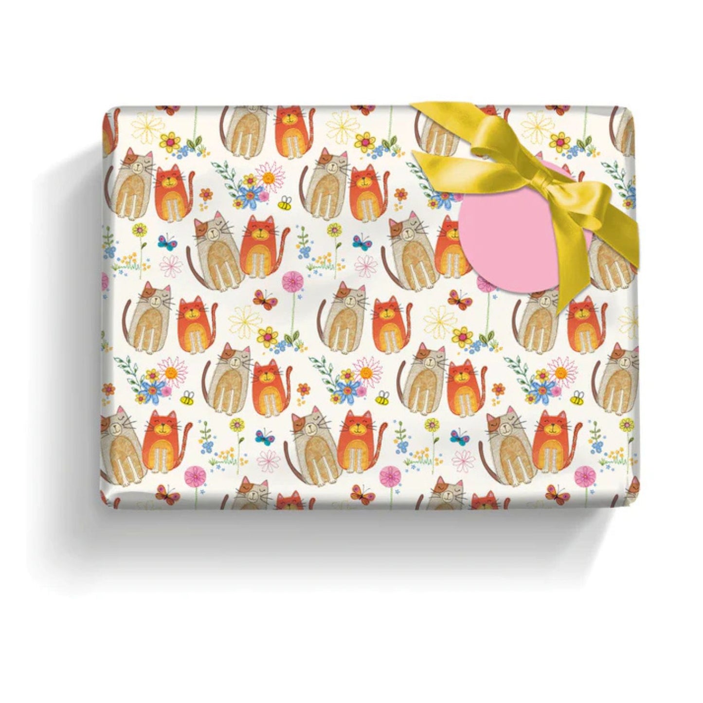 a present wrapped in pretty gift wrap paper with cute brown and orange cats and flower on a white background with a pink  gift label