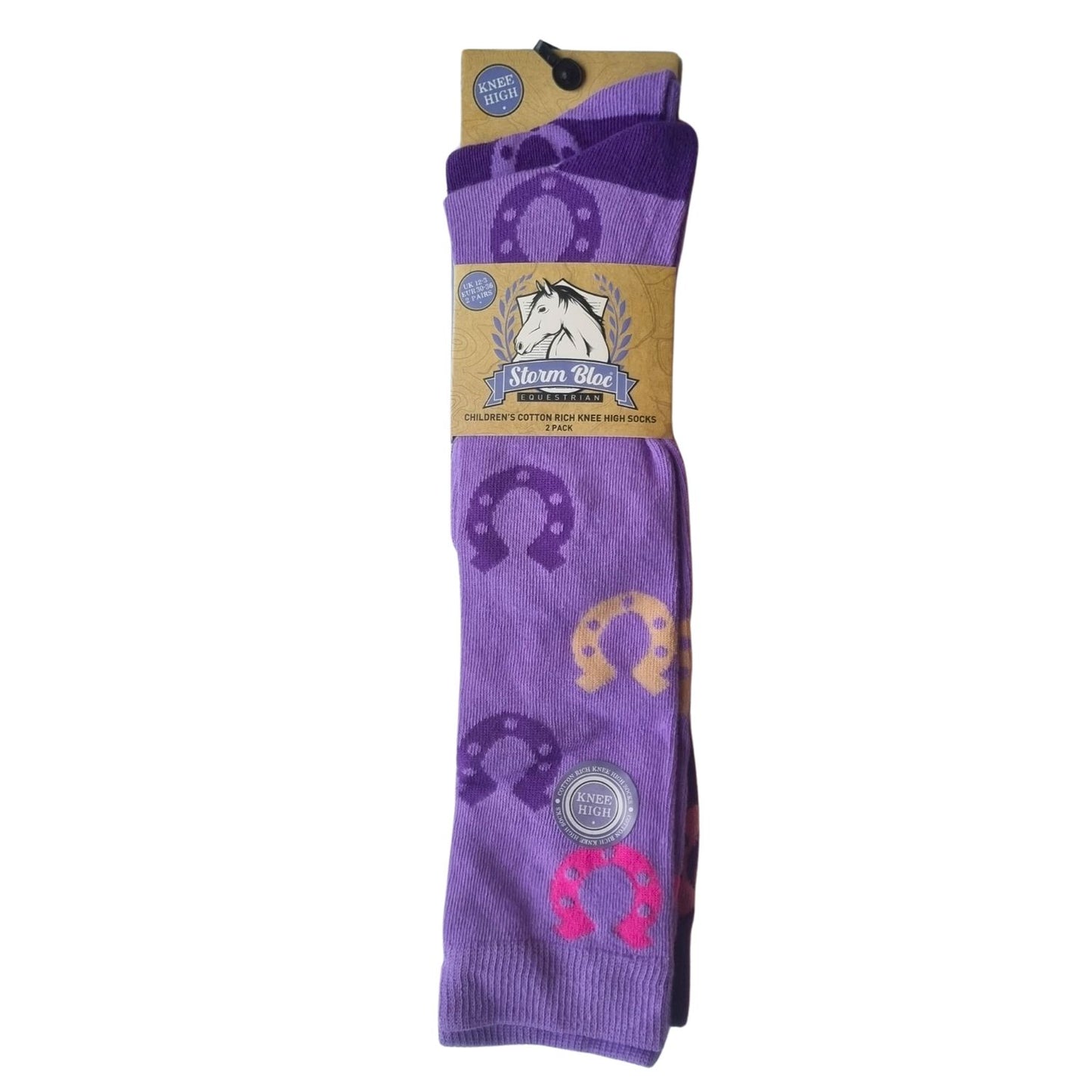 The front of a 2 pair pack of long riding socks showing the lilac sock with pink, purple and beige coloured horse shoes