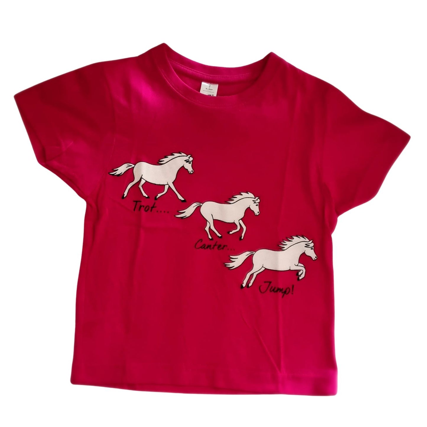 The British Country Collectionâ€™s Childrens Printed Horse T Shirt features three white cartoon horses labeled Trot, Canter, and Jump on the front.