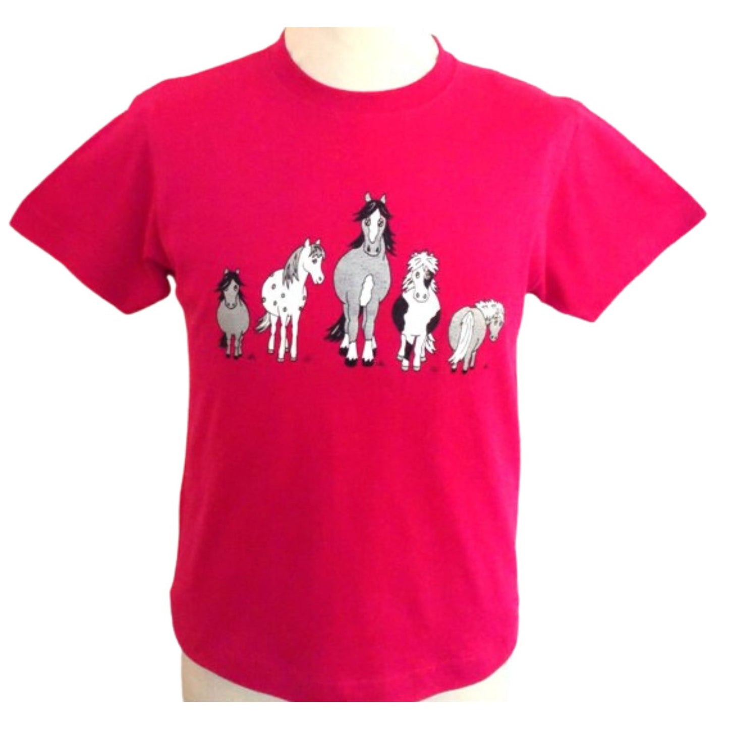 The British Country Collection Printed Horse T Shirt The Herd Design for children (age 1-2) features five cartoon horses across the chest in bright pink, made from 100% cotton for comfort and style.