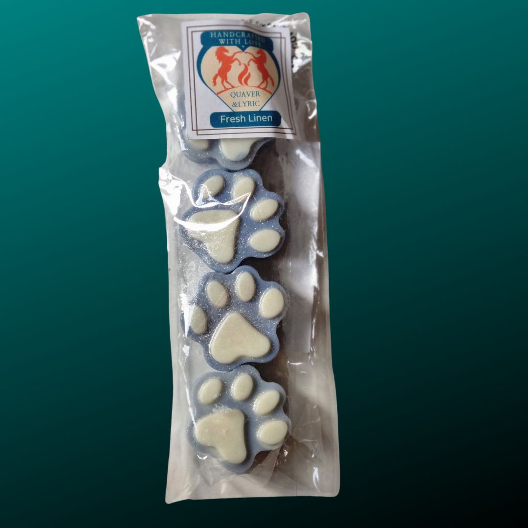 four dusky blue paw shaped wax melts with white paw pads in a packet with quaver & lyric rearing horse branding