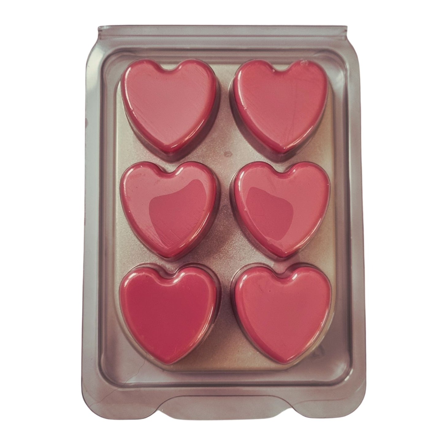 Scented Soy Wax Melts in hearts Clamshell with 6 soft pink Hearts on white wax melt background