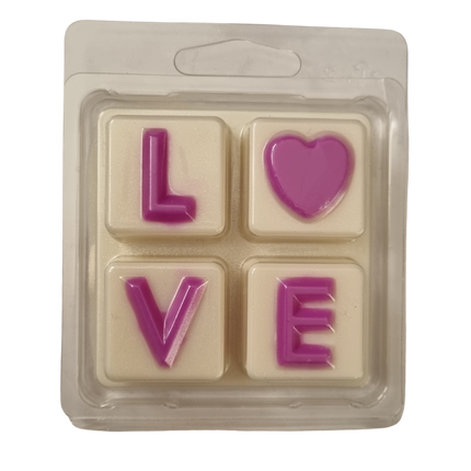 Soy Wax Melts in love Clamshell with bright pink love on white wax melt background