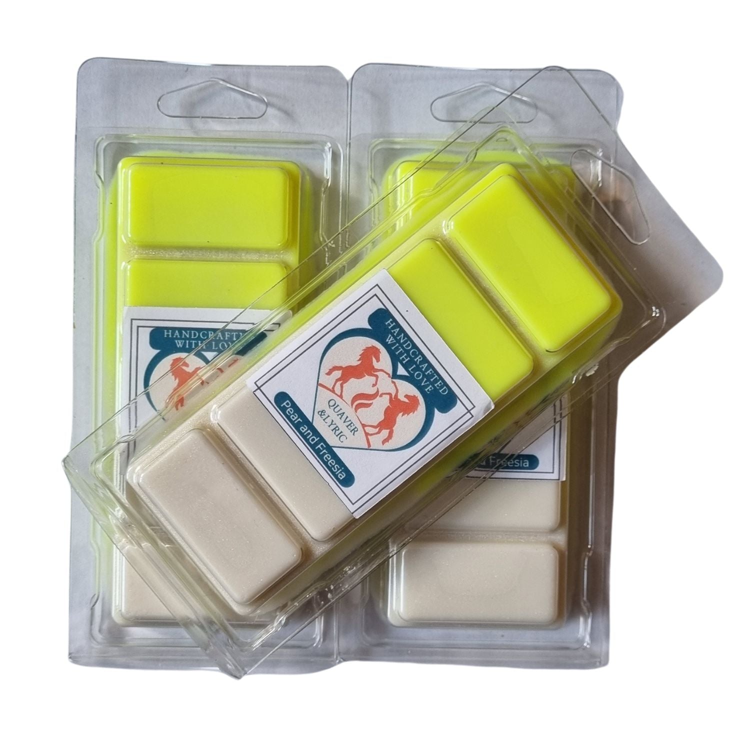  a group of 3 bright yellow and white wax melts in clamshells with quaver and lyric rearing horse branding