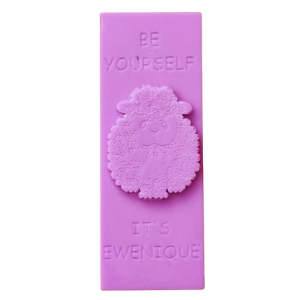 A bright pink wax melt bar with a raised sheep design with the writing be yourself above and it's ewenique below.