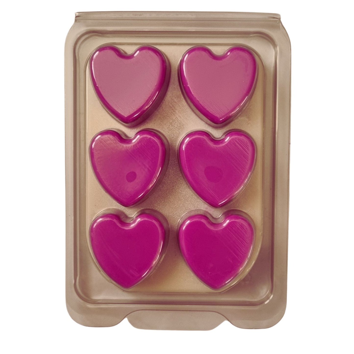 Scented Soy Wax Melts in hearts Clamshell with 6 bright pink Hearts on white wax melt background