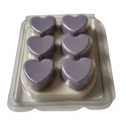 a wax melt bar in clamshell with 6 lilac hearts