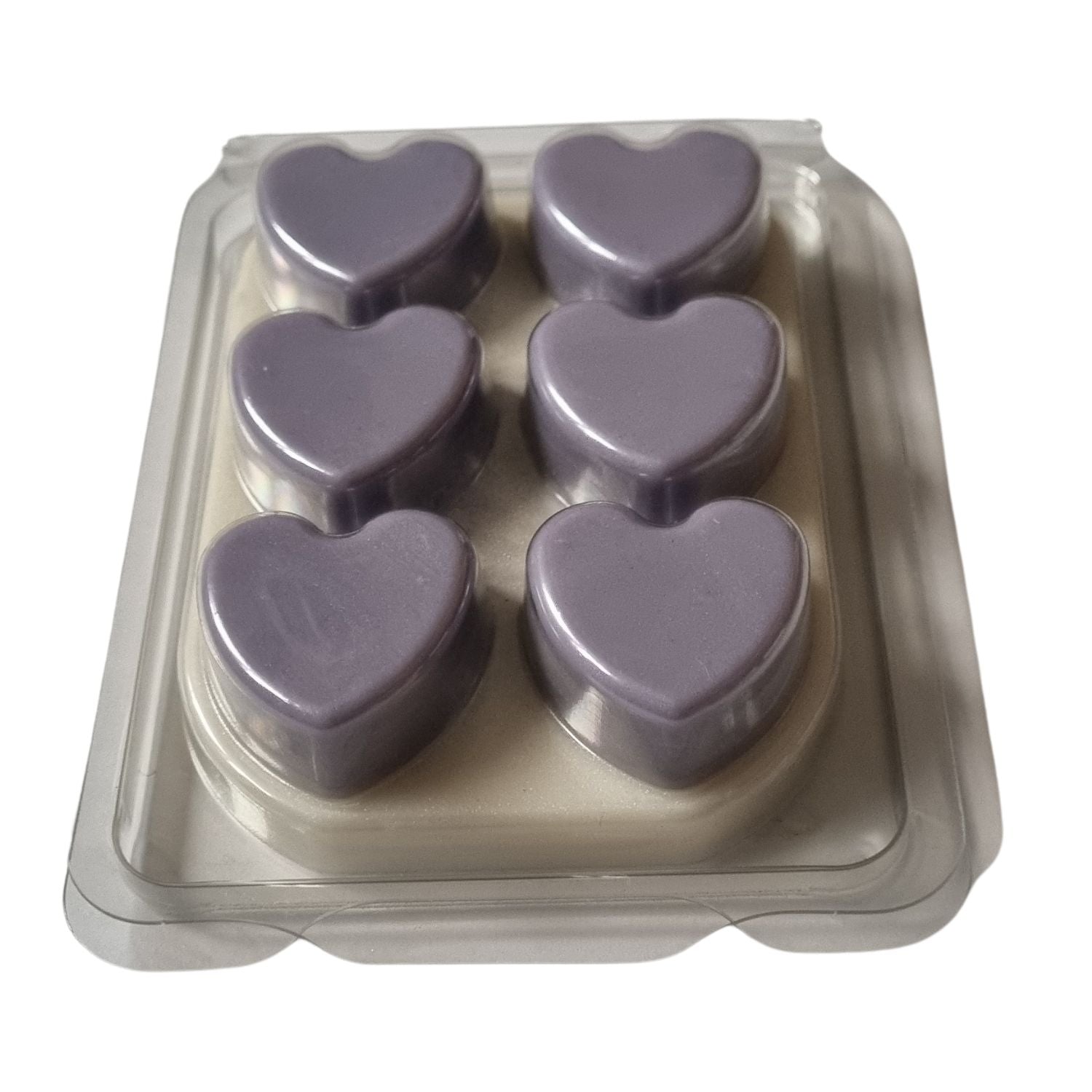 Scented Soy Wax Melts in hearts Clamshell with 6 violet Hearts on white wax melt background