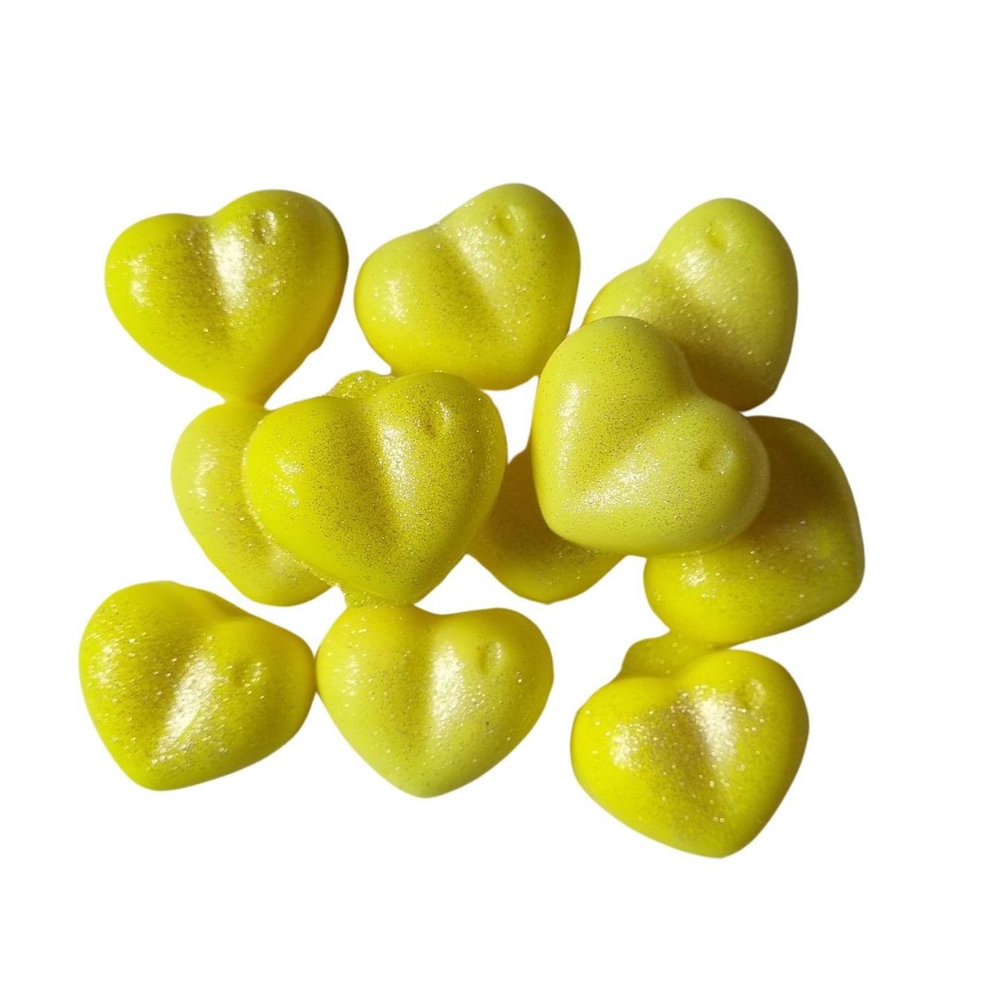 a group of yellow heart shaped soy wax melts